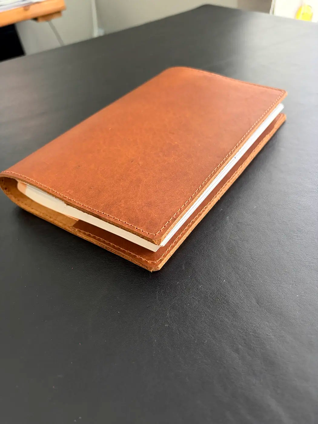 Close view of a leather journal made in our family workshop